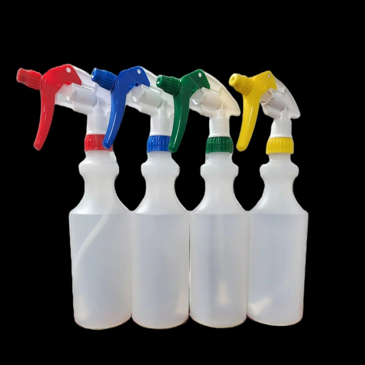 Four translucent plastic spray bottles with trigger sprayers in red, blue, green, and yellow, arranged side-by-side against a solid black background.
